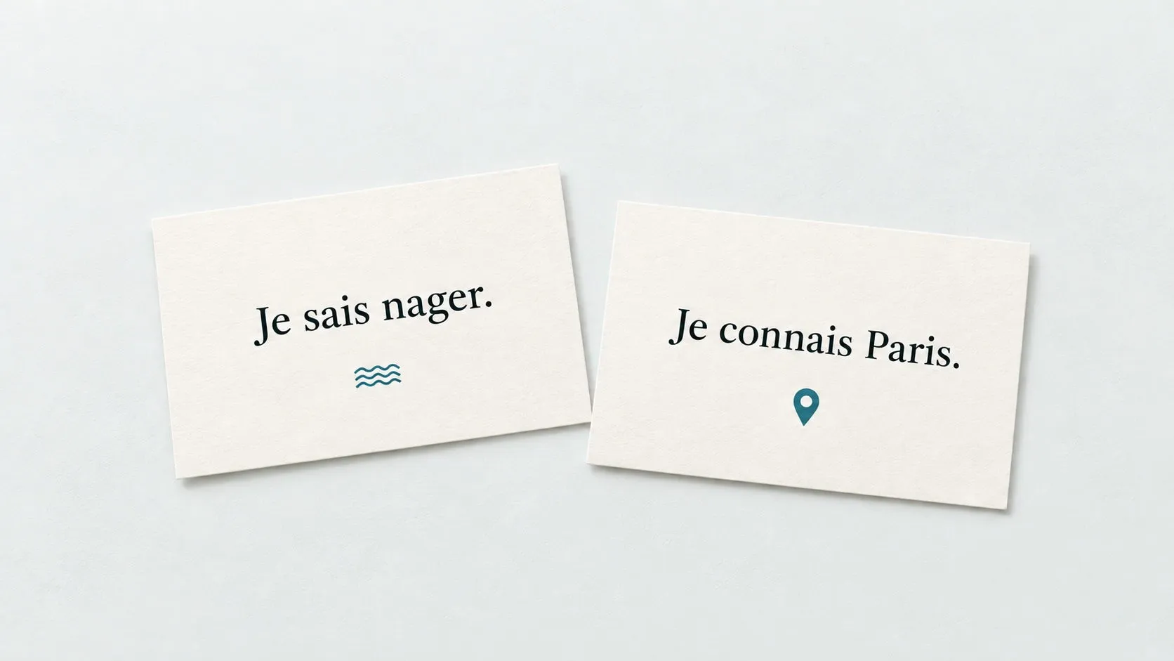 Two illustrative study cards showing the French sentences “Je sais nager.” and “Je connais Paris.” on a light tabletop